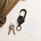 TUGLO key keeper flat lay with house keys, blank access card and taupe backpack
