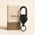 TUGLO retractable key keeper beside a warm kraft TUGLO SnugLlama packaging concept