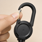 Close-up showing how the silver gate on the TUGLO integrated carabiner opens